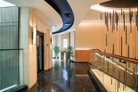 Metal-framed lift lobby doors at Business Square