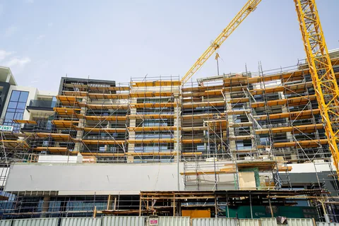 Tower crane over the Dubai South structure during construction